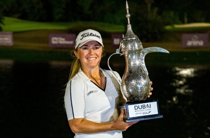 England's Bronte Law with the trophy after her one-shot win at the Dubai Moonlight Classic at the Emirates GC in Dubai. Photo: Tristan Jones/LET